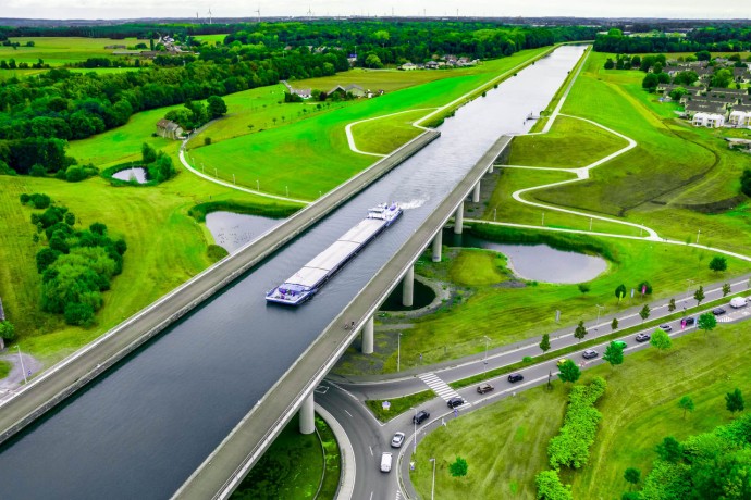 aerial view of the sart canal bridge crossing road in the green landscape of Belgium