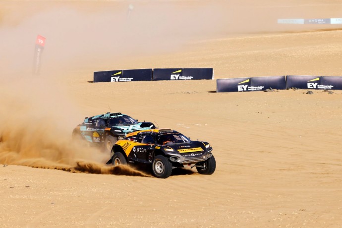 Cars in action during the Extreme E 2024 race in Saudi Arabia