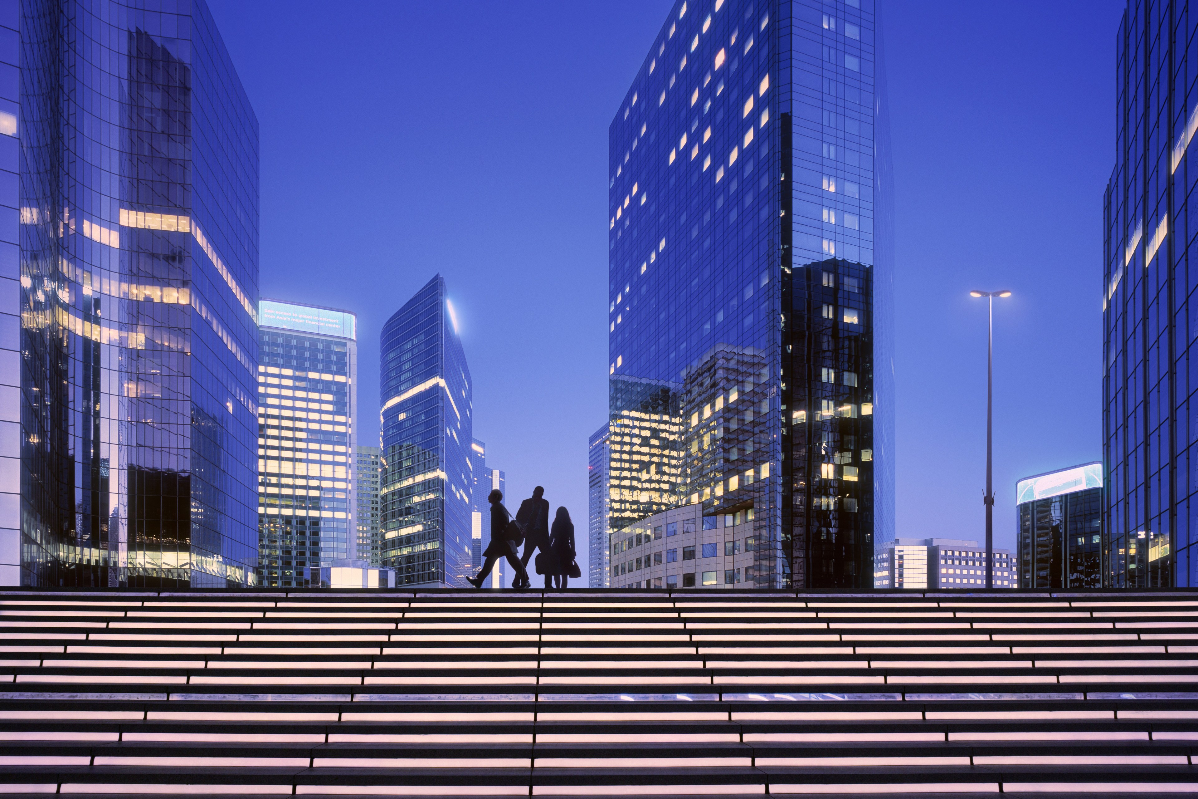 Female sailboat captain in red jacket
