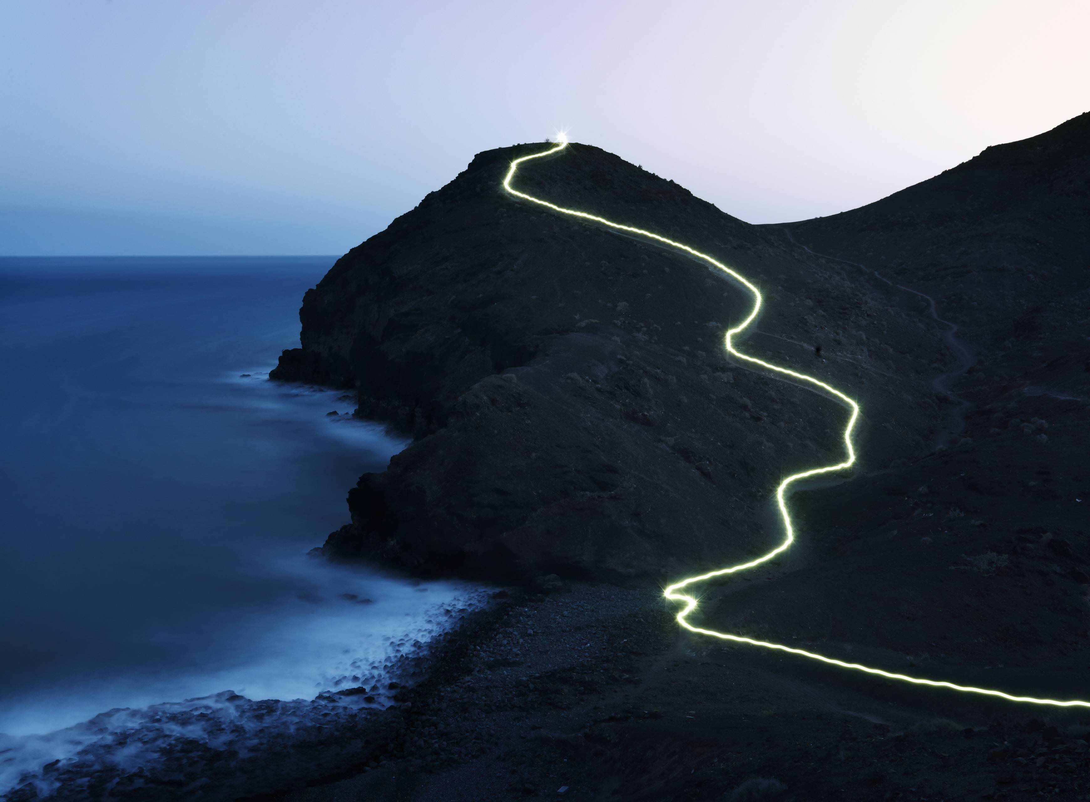 Light running down the mountain at dawn.