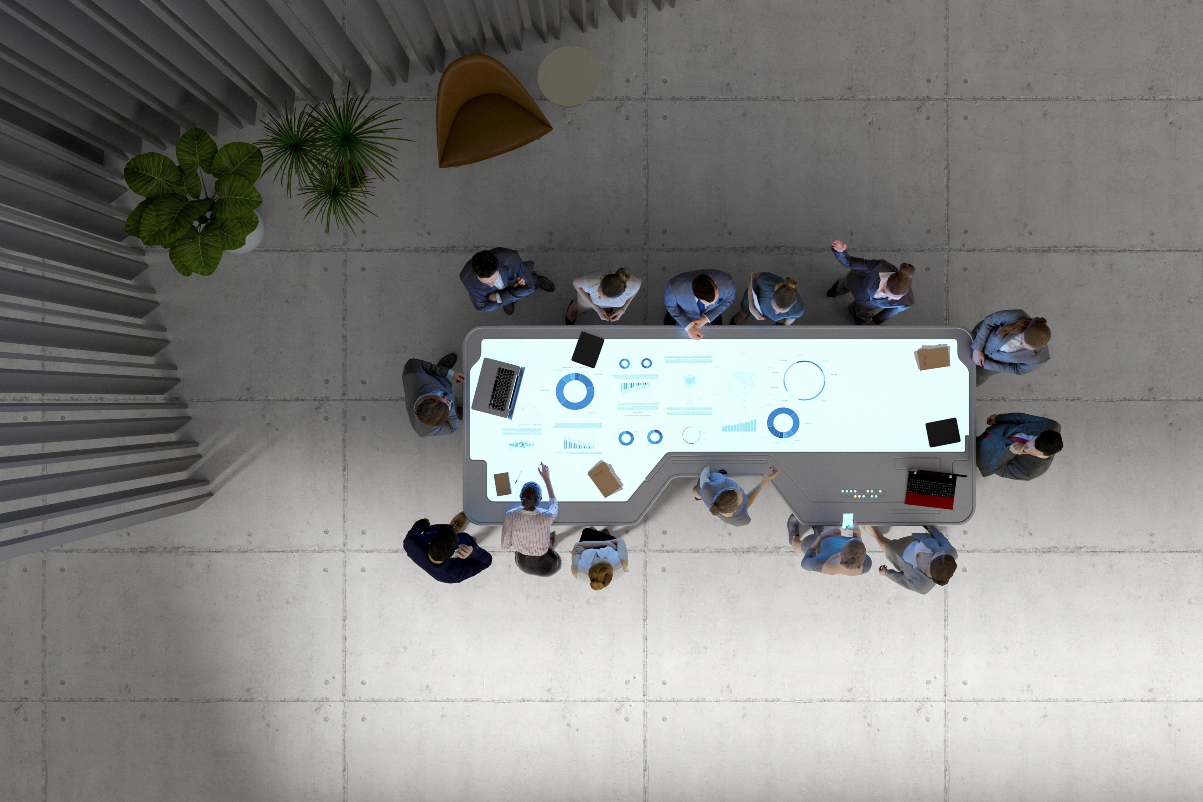 Group of businesspeople with futuristic working desk