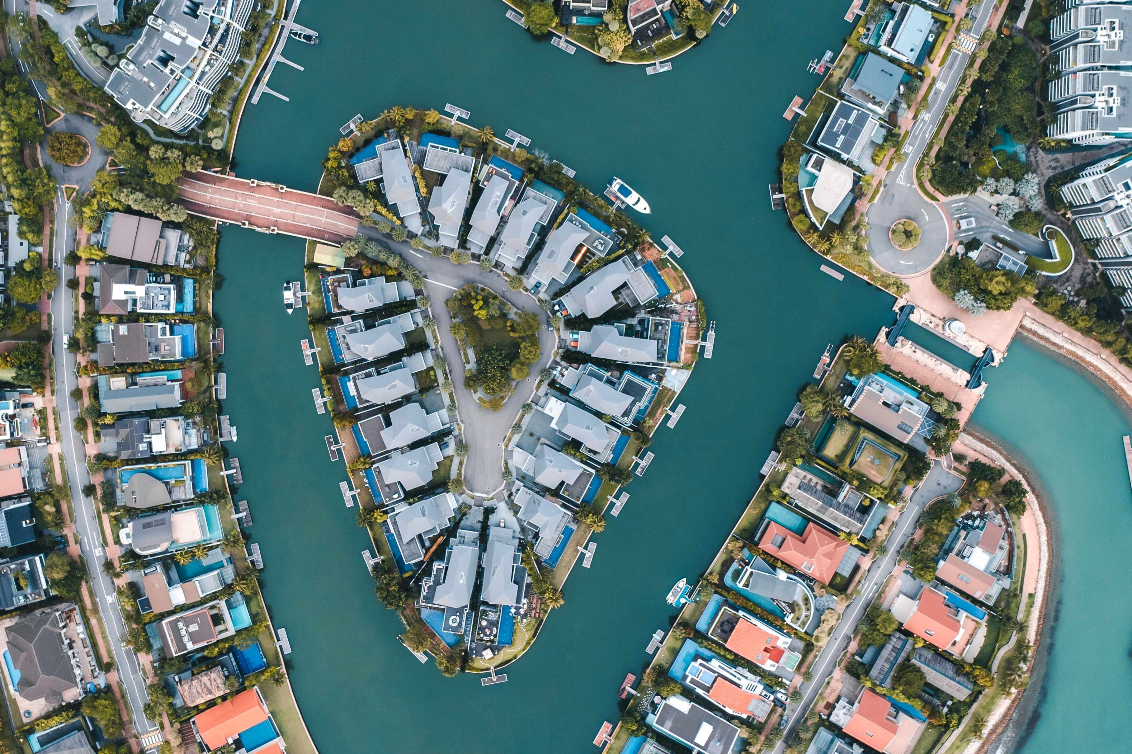 Aerial view of city surrounded by water body