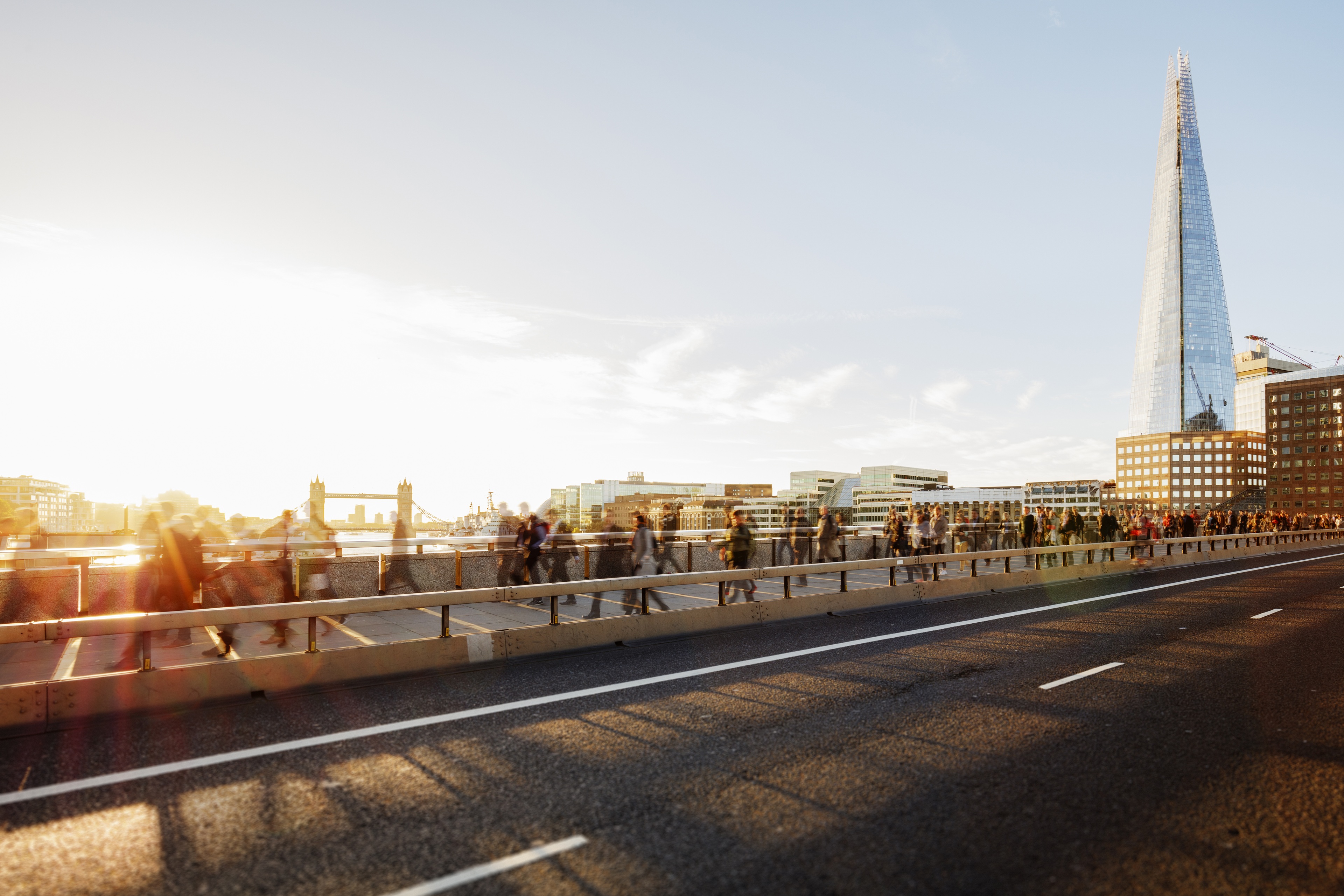 Large number of business people walking to work via London Bridge