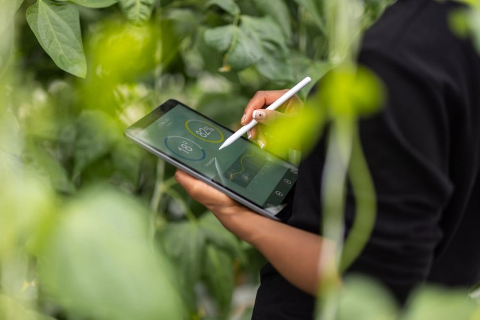 Agronomist using digital tablet