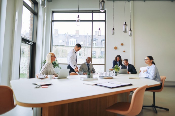 Businesspeople working together around a boardroom table