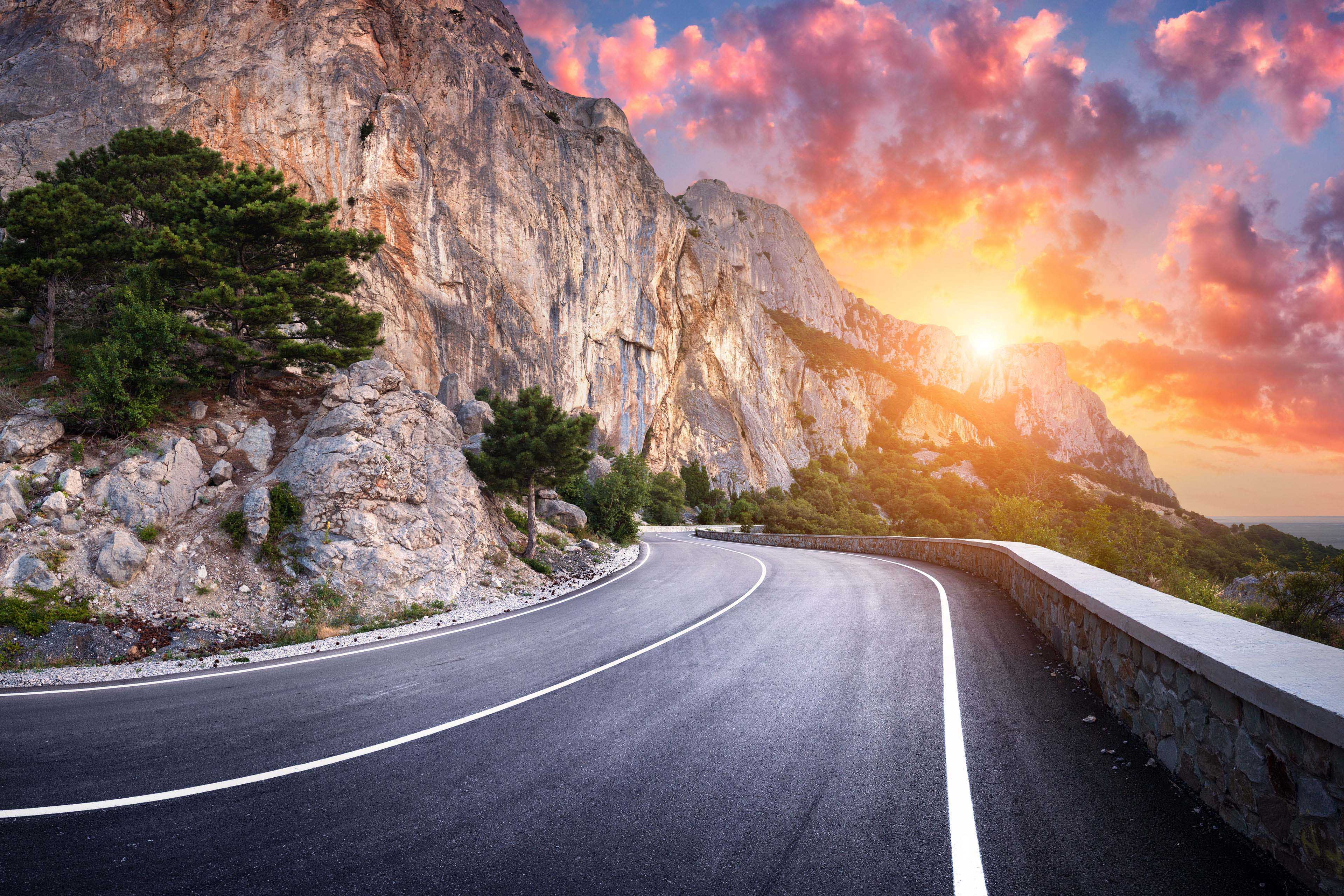 Asphalt road. Landscape with beautiful winding mountain road with a perfect asphalt in the evening. 