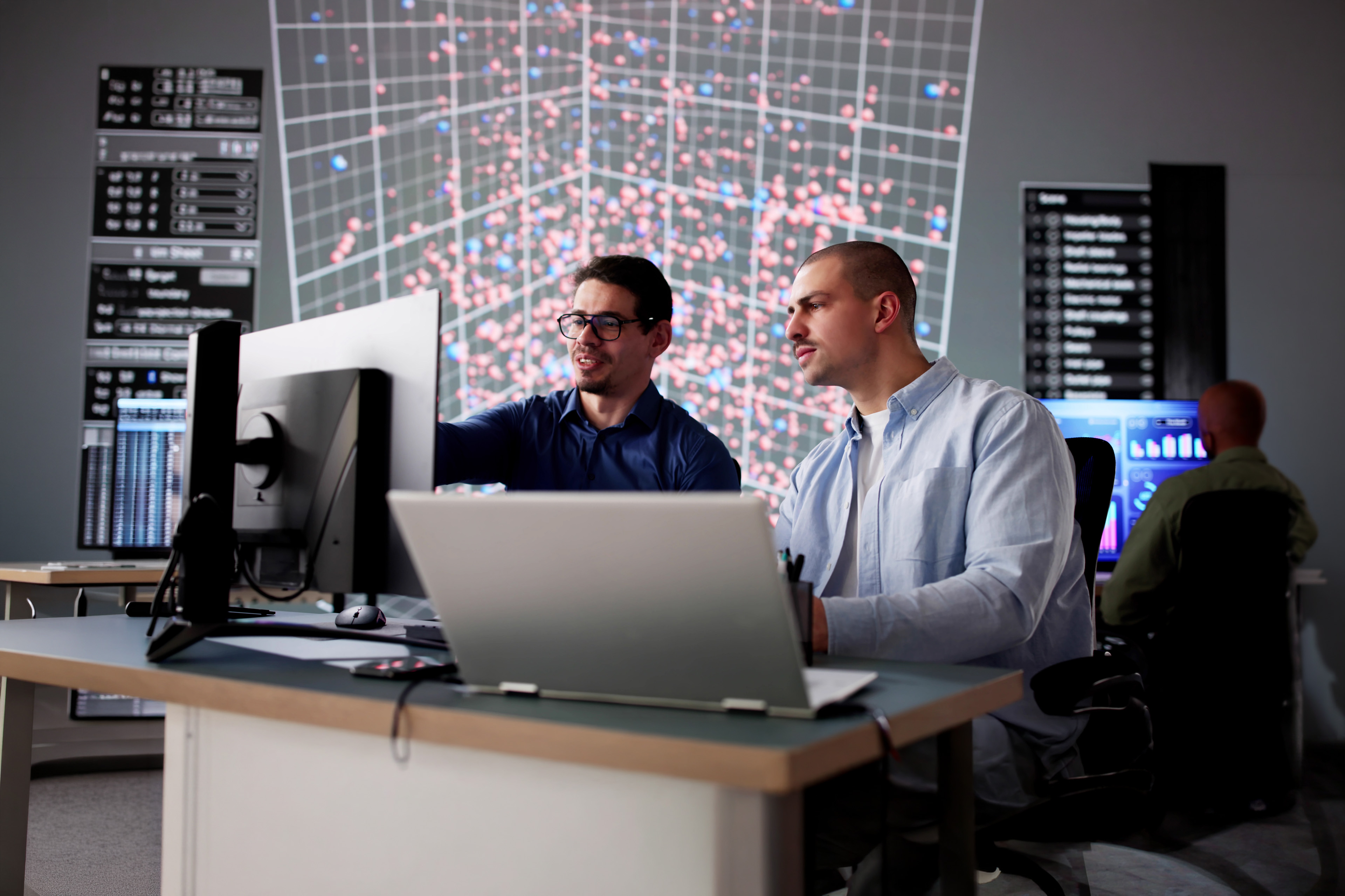 A diverse group of professionals work together to ensure the security of computer technology and data.