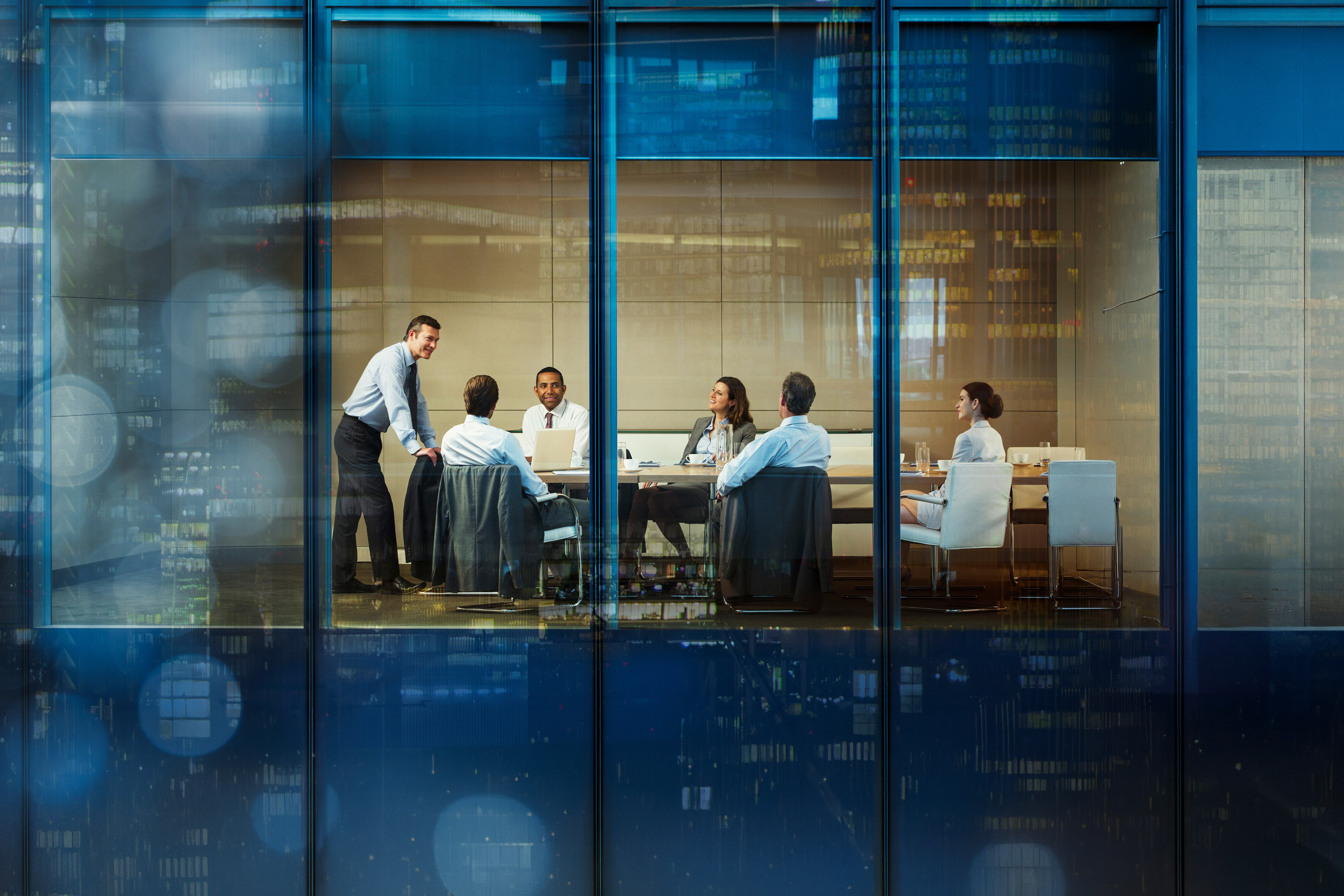 Business professionals meeting around a conference table in a modern office