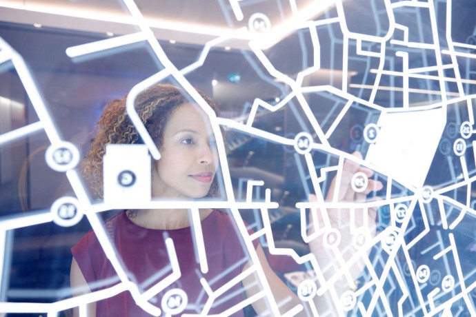 Woman interacting with large grid map