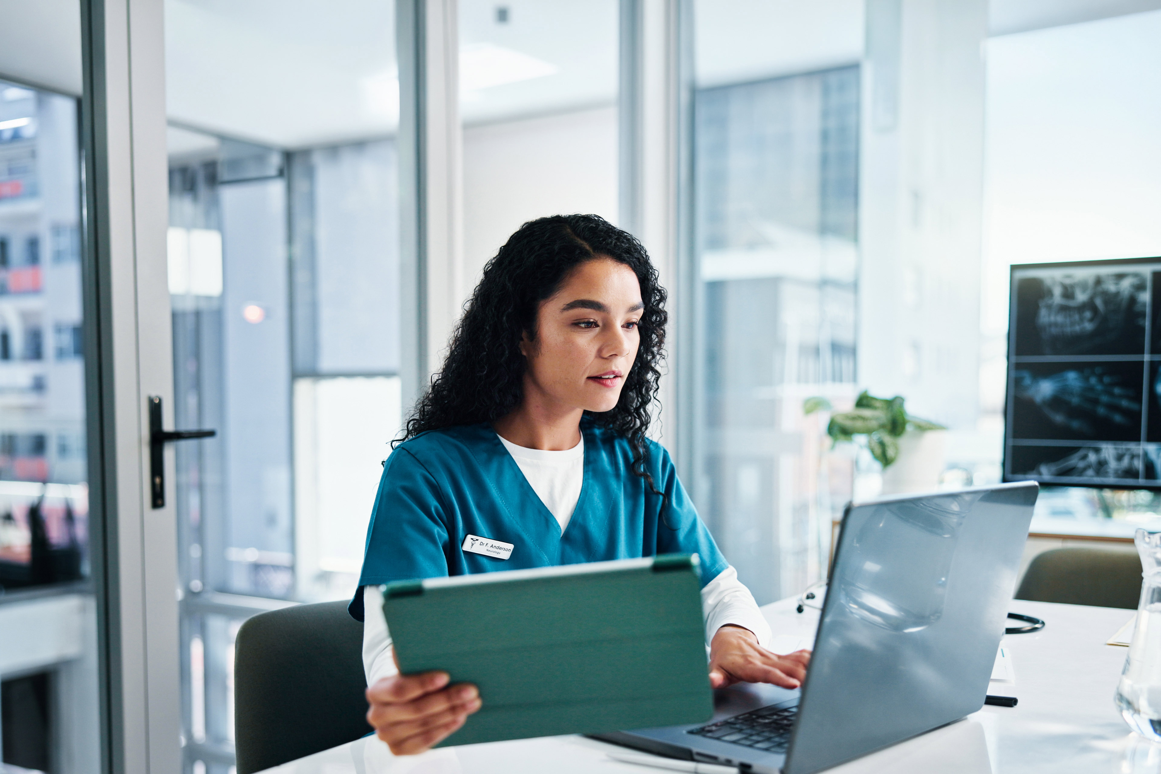 Female person, healthcare worker or employee with technology for telehealth or health app at clinic.