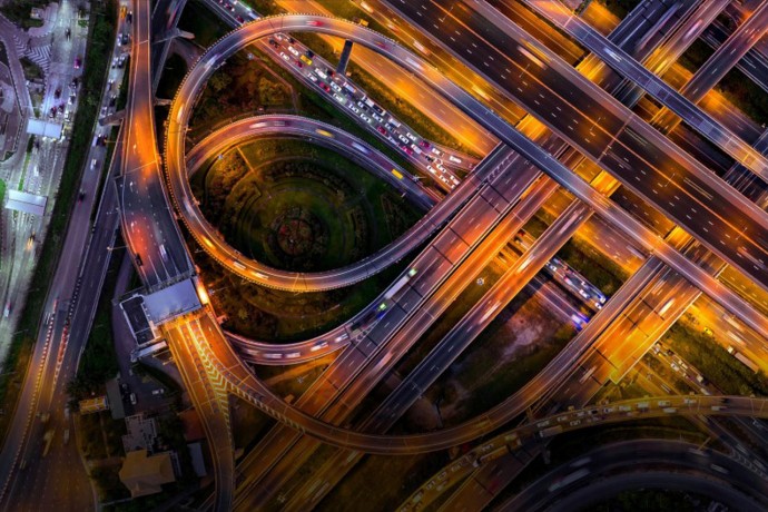 Aerial view of traffic on massive highway intersection at night