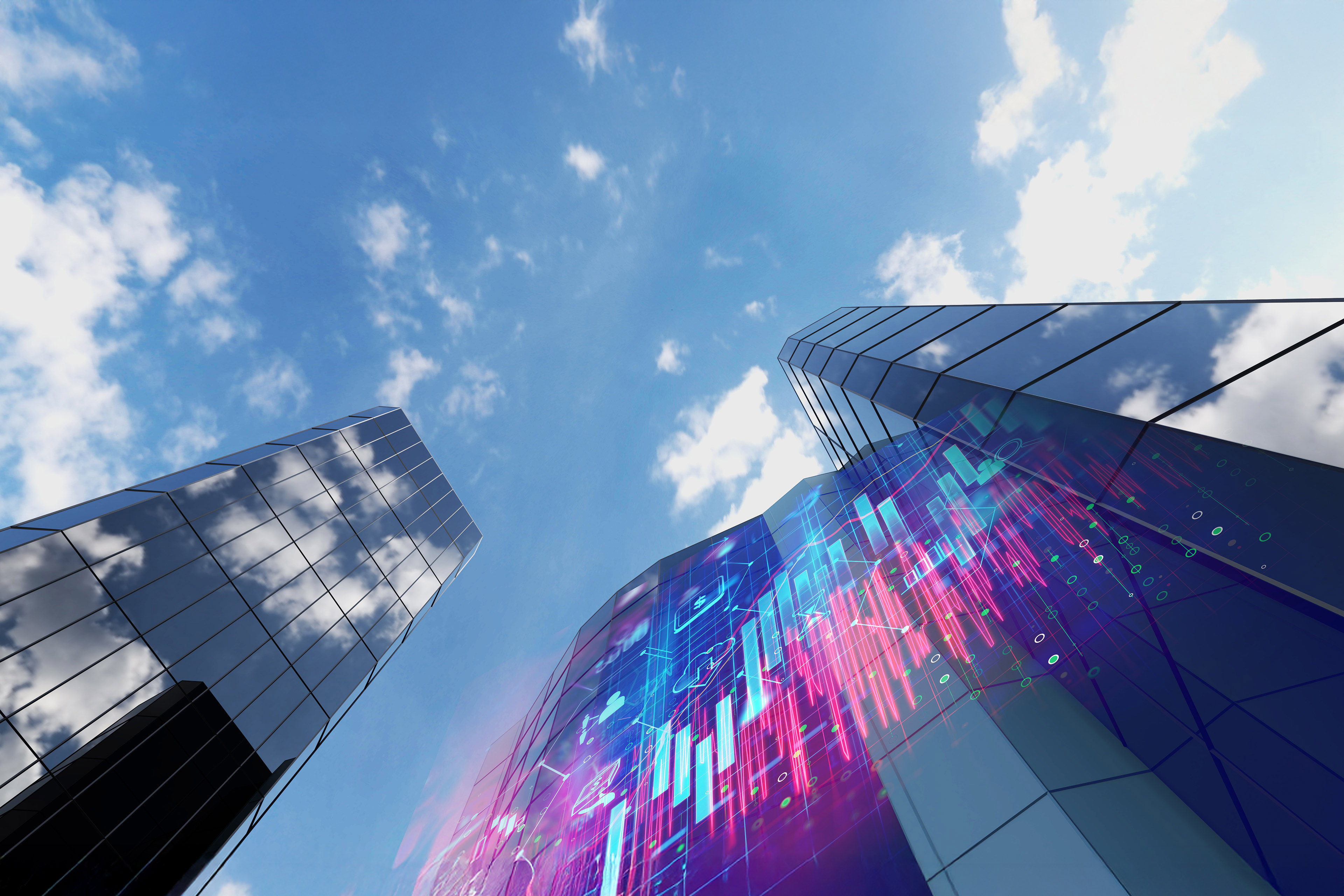 Man working on laptop while sitting in kitchen at home