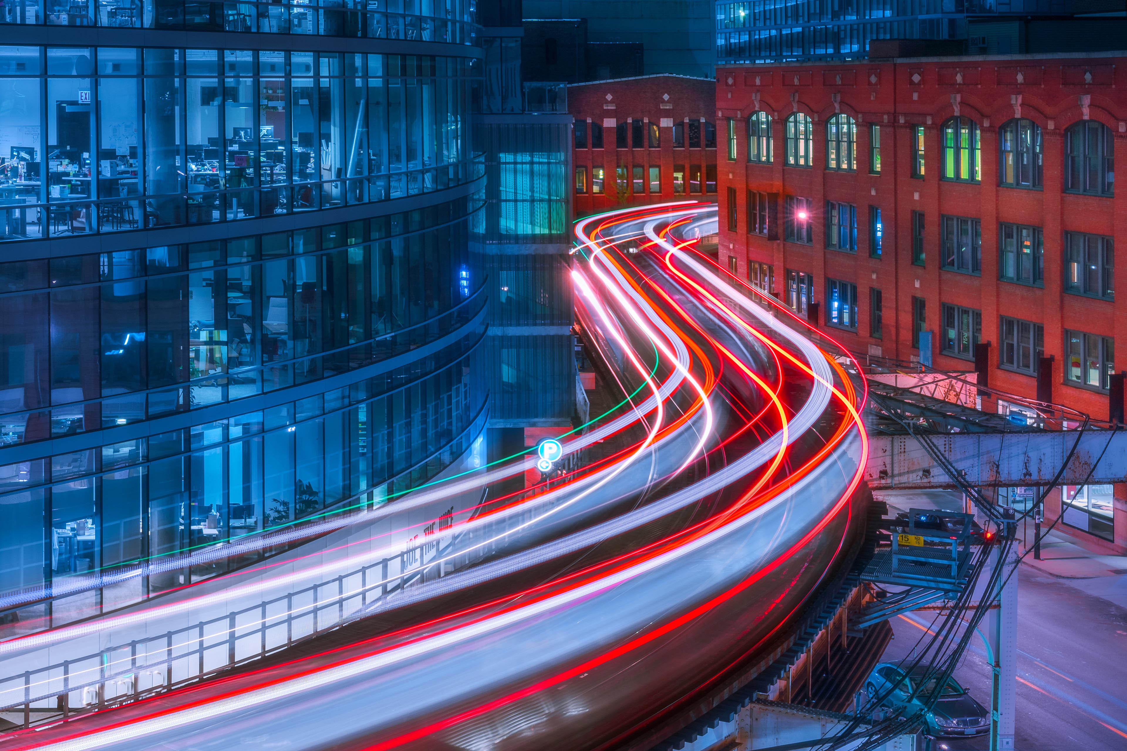 Man working on laptop while sitting in kitchen at home