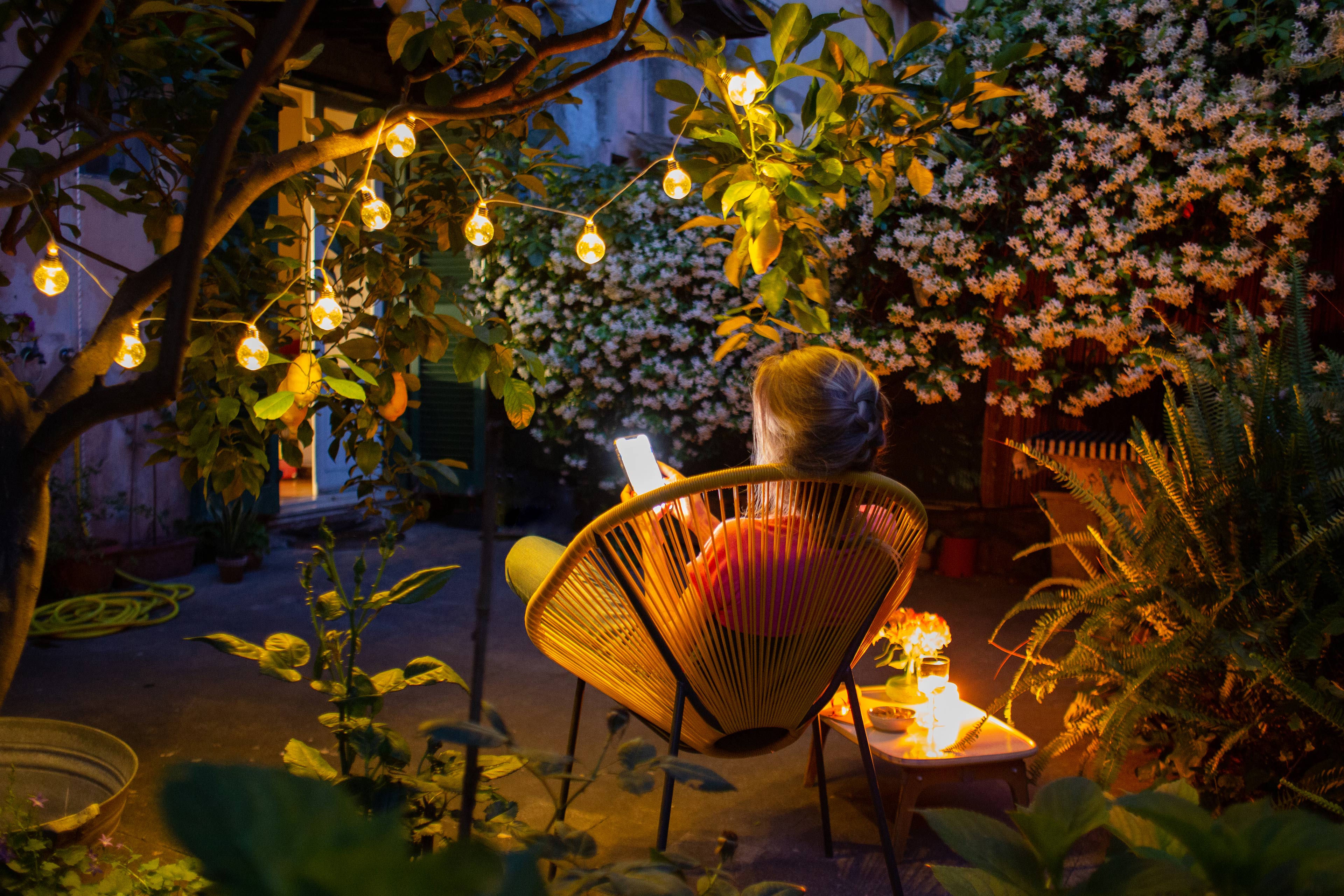 Man working on laptop while sitting in kitchen at home