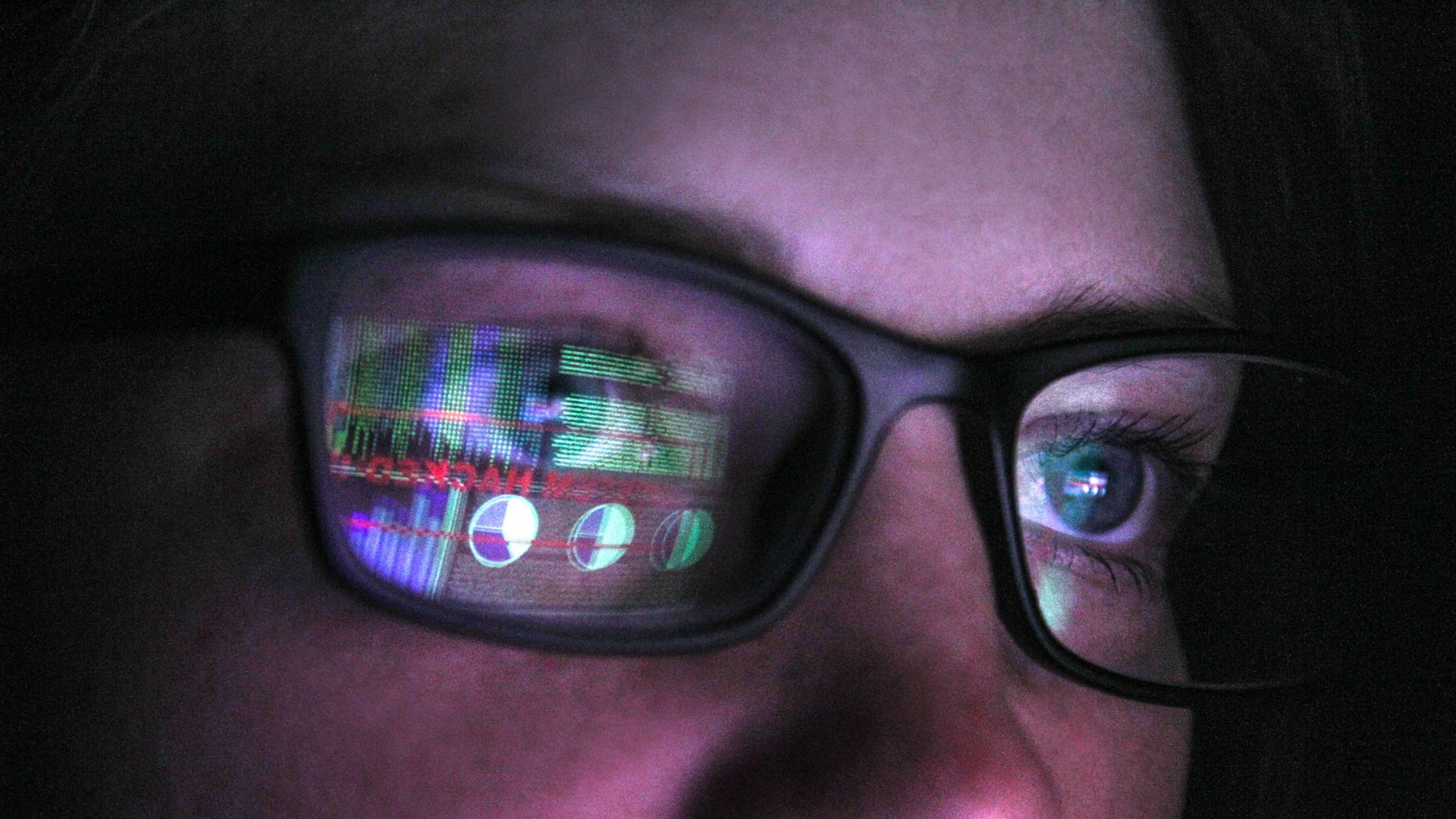 Two adults work together in a bright data center