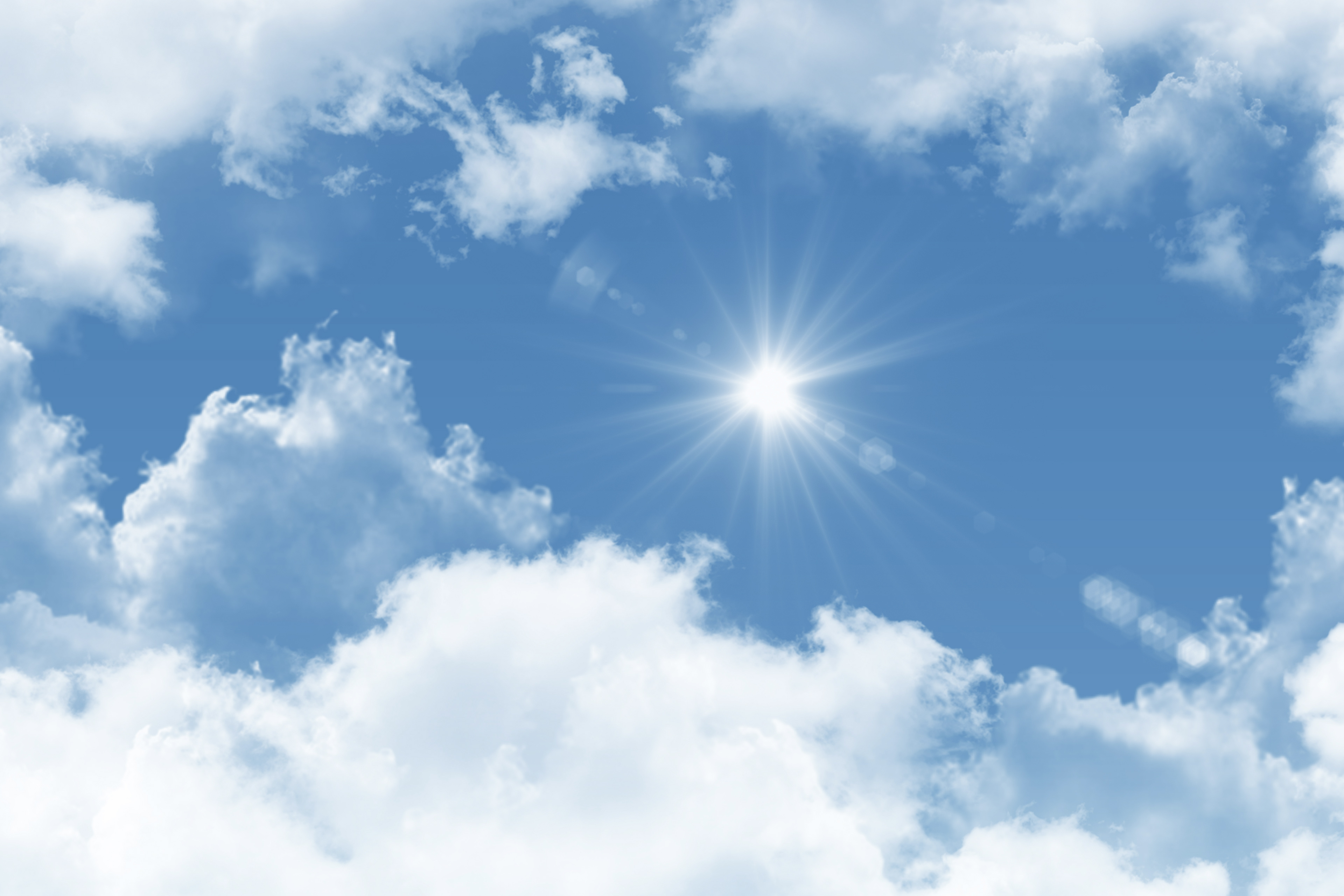 Un soleil brillant brille dans un ciel bleu clair, entouré de nuages blancs.