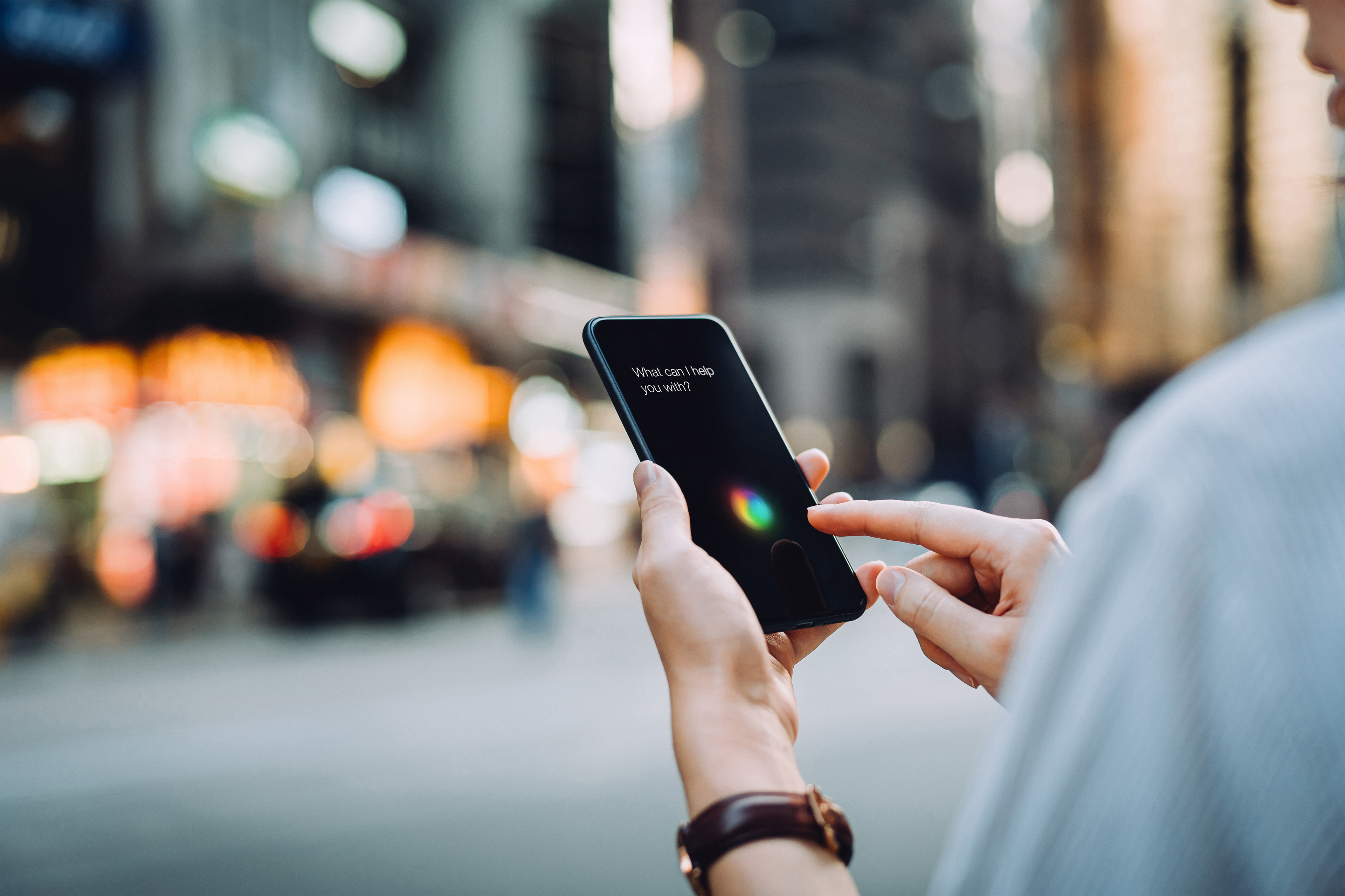 EY young businesswoman using ai assistant on smartphone
