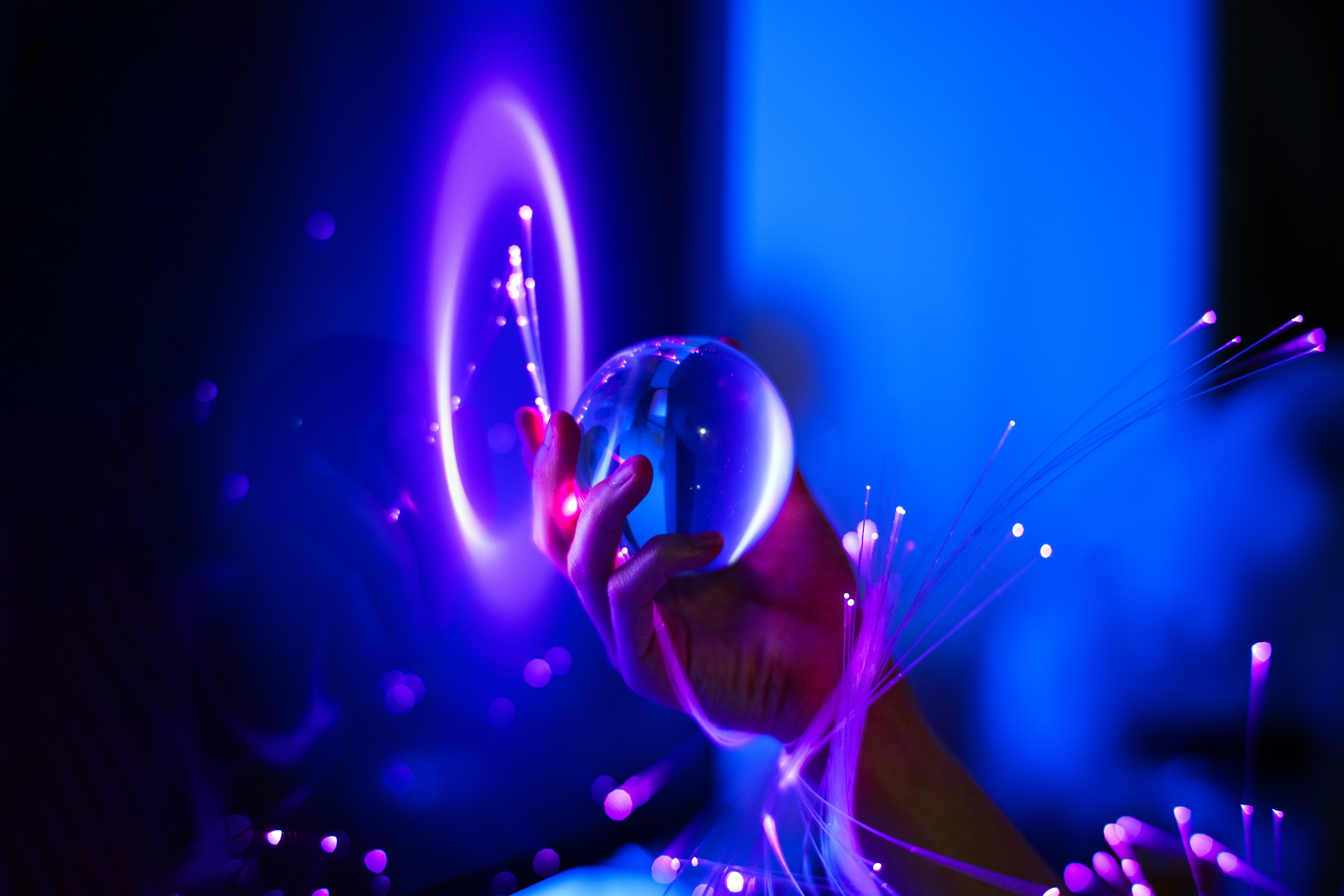 Glowing glass orb in hand