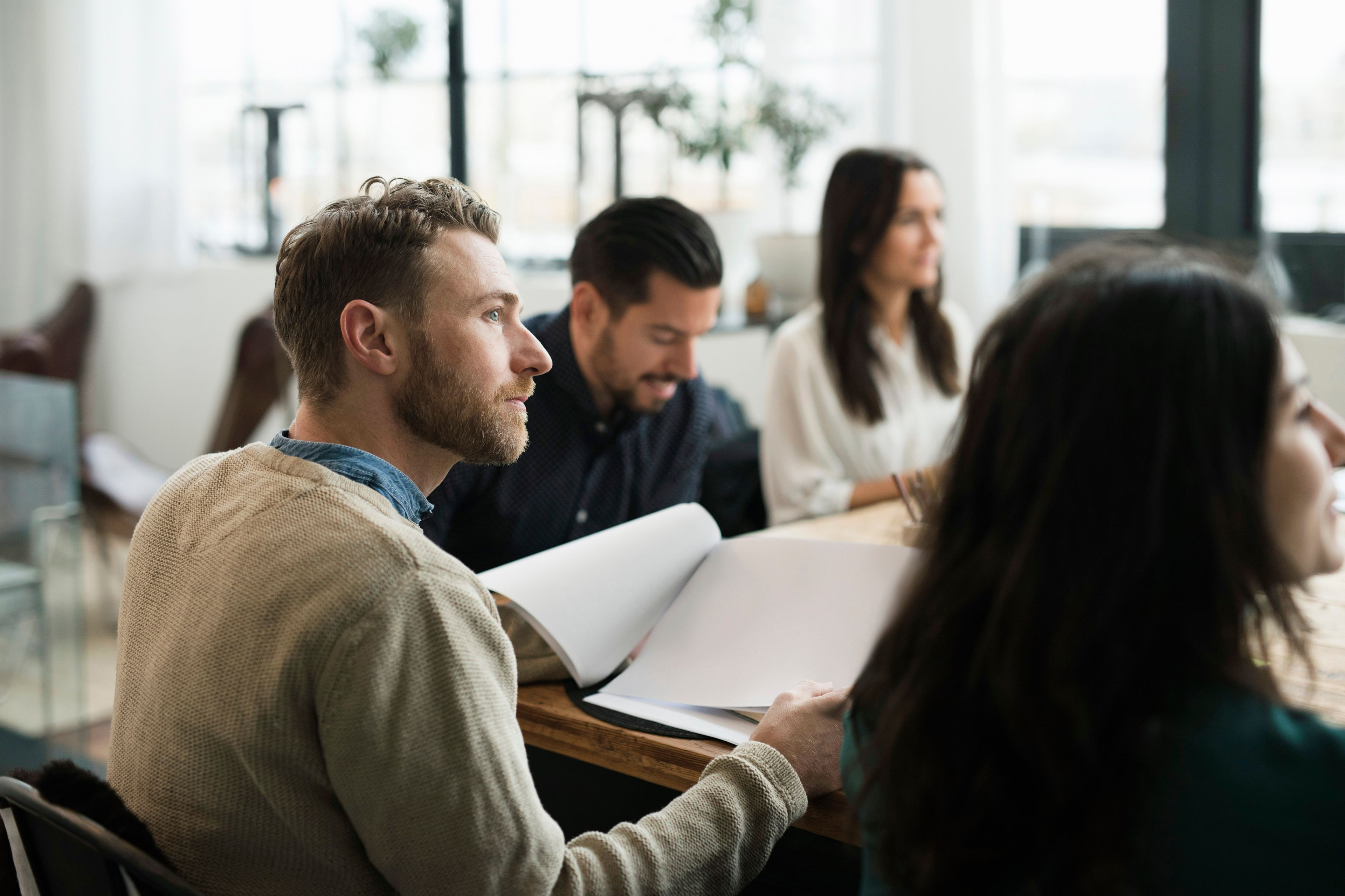 People sitting in a meeting around a table