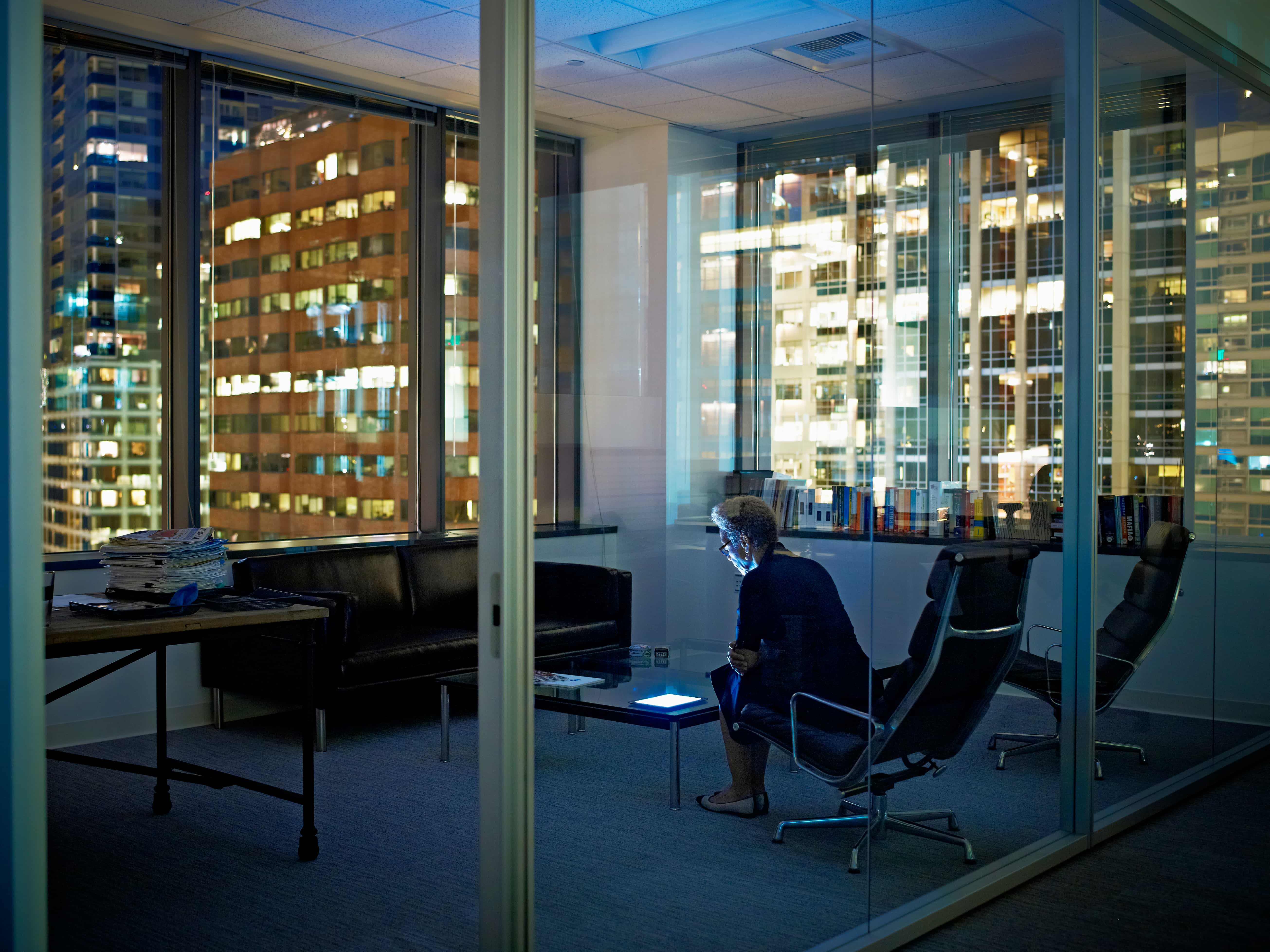 ey-woman-with-digital-tablet-in-office-at-night