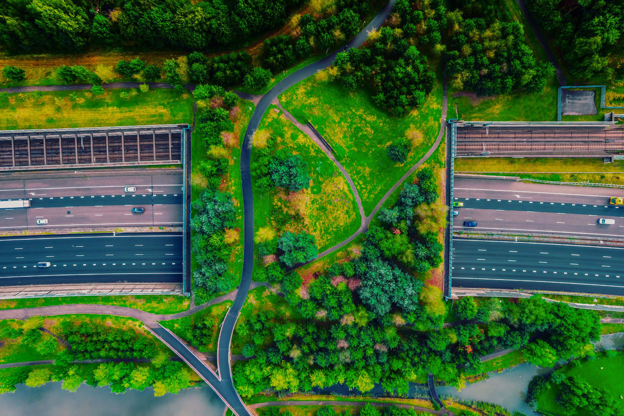 Drone view of green bridge with public park crossing above highway netherlands.