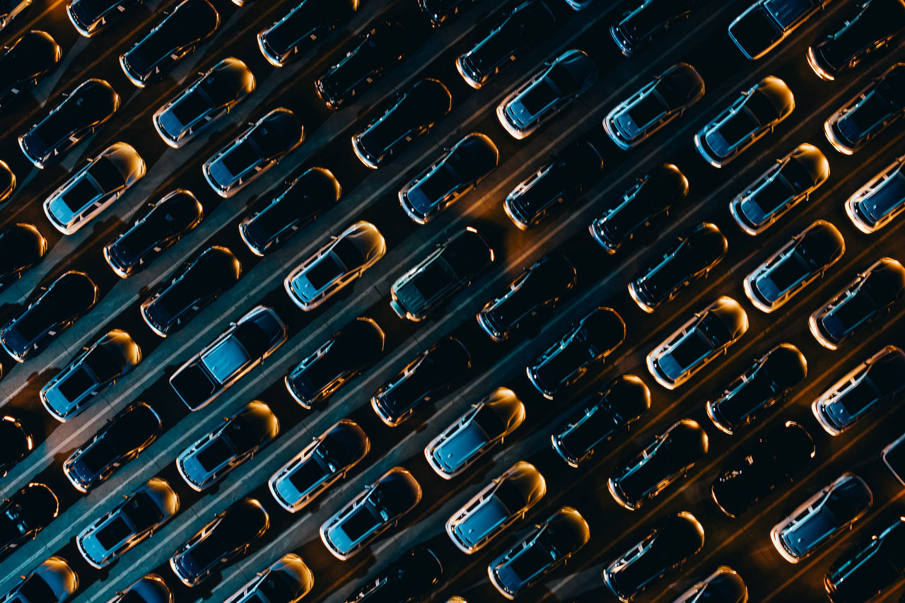 Aerial view of cars undergoing various technical tests at night.