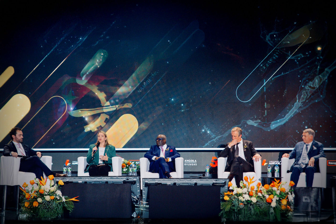 Young man contemplating from building terrace at sunset