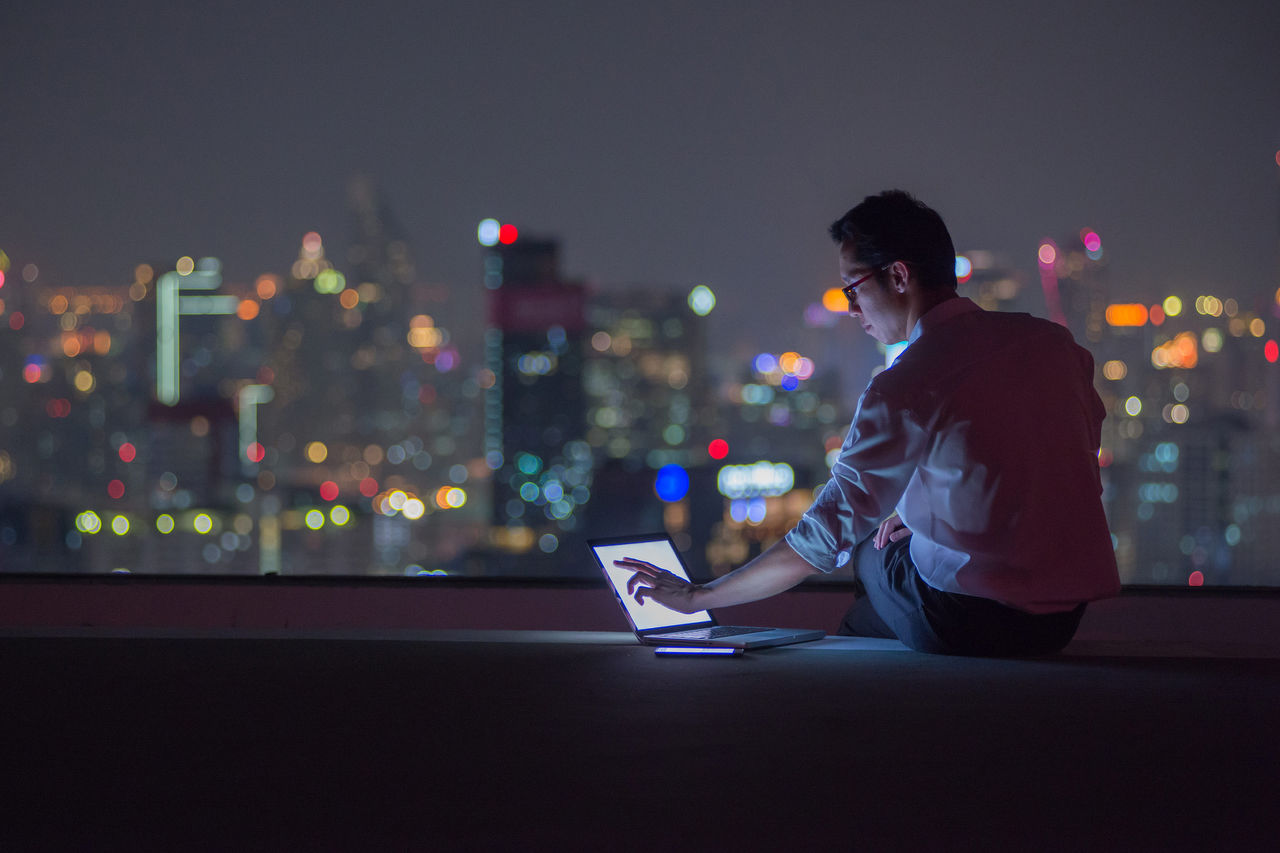 A young man using his laptop