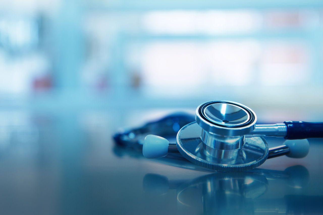 stethoscope for medical doctor diagnosis on blue health science laboratory background