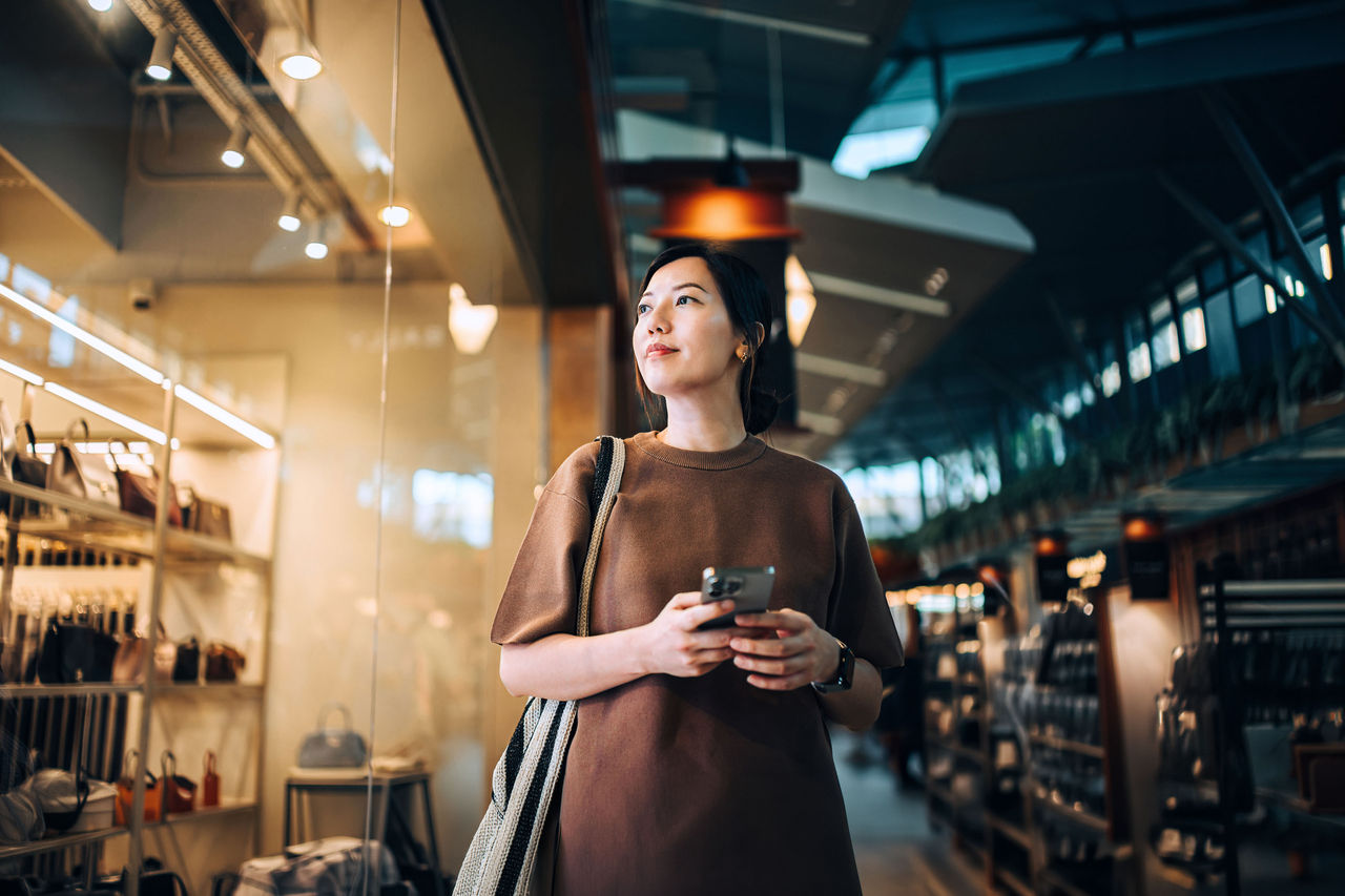 Window shopping. Digital shopping technology. Sales season. Seasonal shopping and consumerism concept