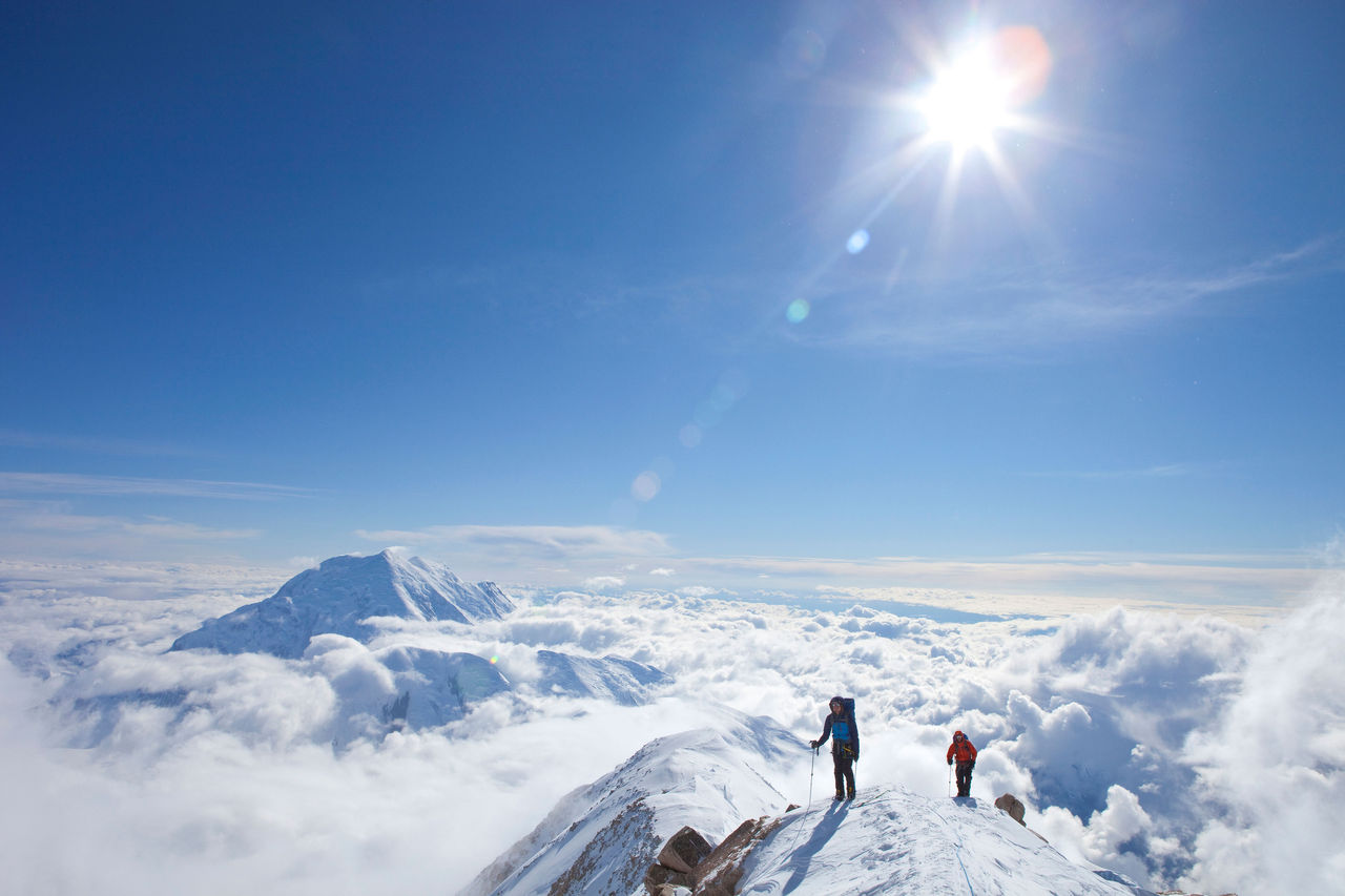 Two male climbers at the ridge between 