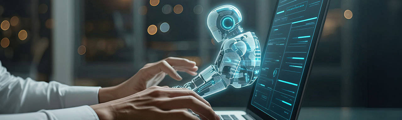 Man using laptop with visualisation of AI chatbot