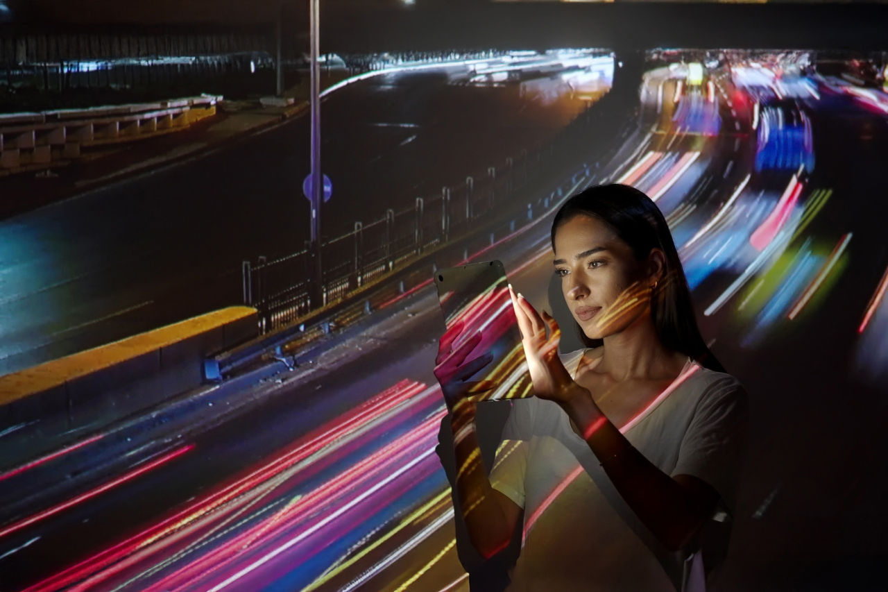 Image projection on a woman using a digital tablet